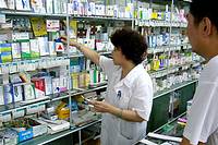 Pharmacist serving customer